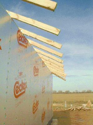 Roof beams are secured in place. 1/15/99