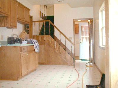 Kitchen, stairs, and entrance are crisp and appealing. 1/12/99