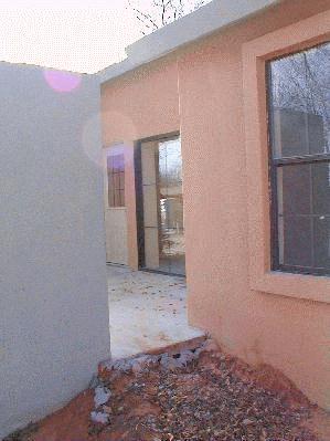 Looking through the front courtyard to the house. 12/9/98